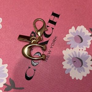 Coach bag charm